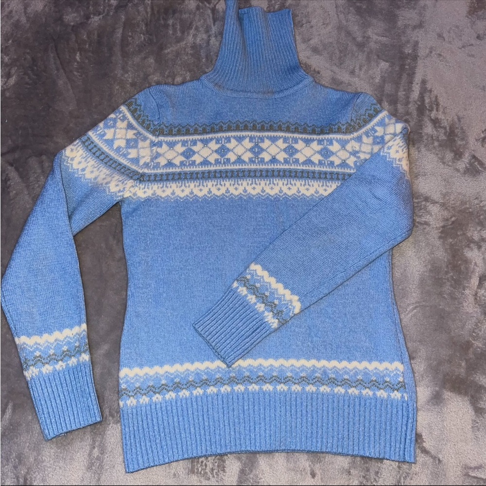 Light blue long sleeve/ turtleneck winter sweater with beads on the chest area